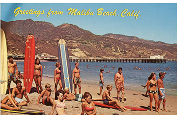 Historic photo of surfers and beach goers from 1960.