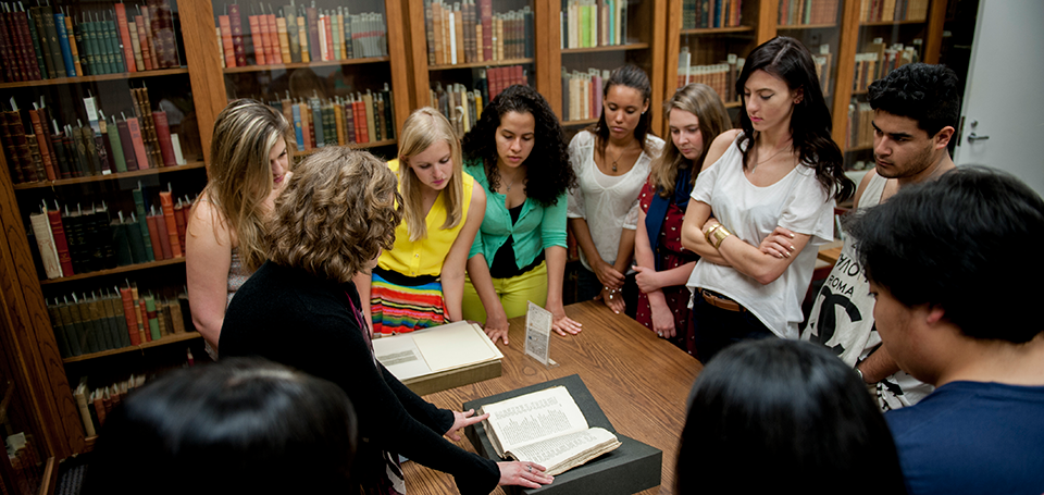 Students gathered around a table for instruction