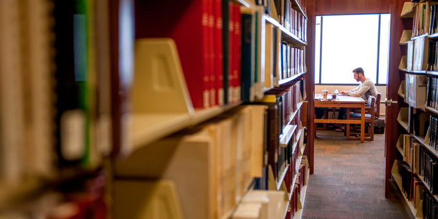 student studying among the collections