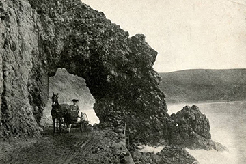 historic image of car in tunnel