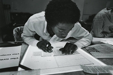 student looking at documents