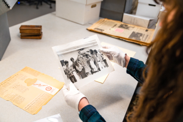 worker organizing special collections materials