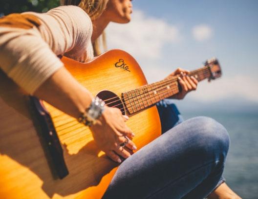 girl playing guitar
