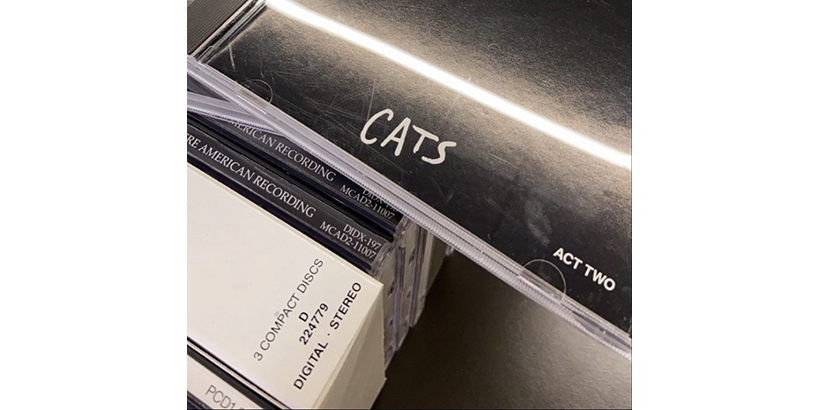 Image of stack of CDs, with Cats displayed on top.