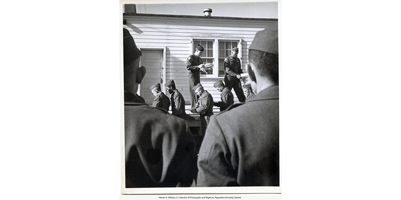 Image of soldiers opening letters