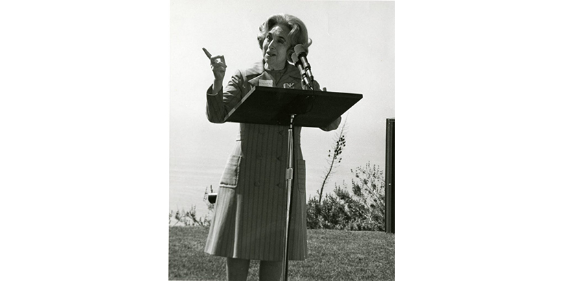 Image of Margaret Brock at a podium.