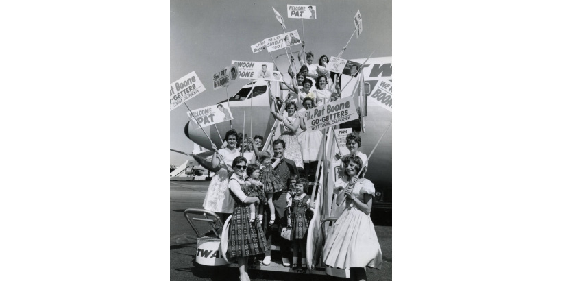 Pat Boone and family in front of plane