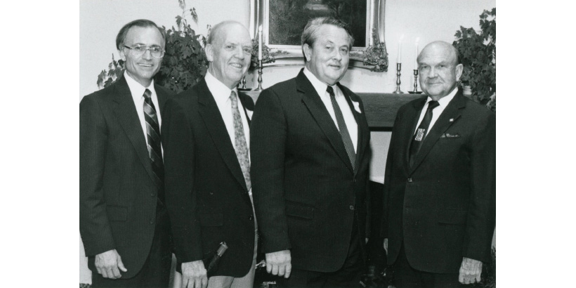 Jerry Rushford with Frank Pack, Tom Olbricht, and Norvel Young (left to right) in Brock House following a lecture program in 1987