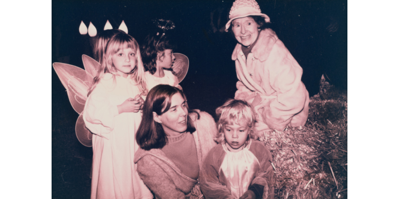 (L to R) Angels, Reverend Susan Klein, a small shepherd, and KCIC founder Mary Kuepper on the Fourth Sunday of Advent. Diane Baldwin. 1991. Malibu Times Collection. 