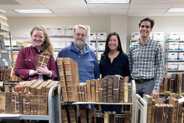 HUTE faculty sorting through books