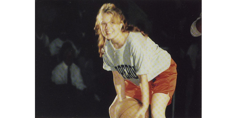 Student Nicole Wade attempts a half-court shot for a year's worth of free tuition.